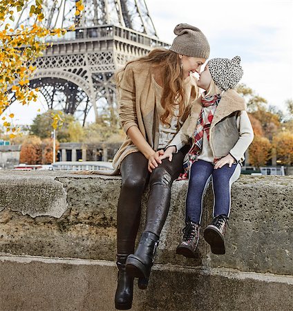 simsearch:400-09031587,k - Autumn getaways in Paris with family. Full length portrait of smiling mother and daughter travellers on embankment in Paris, France sitting on the parapet Stock Photo - Budget Royalty-Free & Subscription, Code: 400-08863348