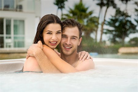 Young couple in a luxury hotel embraced inside a jacuzzi and enjoying the holidays Stock Photo - Budget Royalty-Free & Subscription, Code: 400-08863373