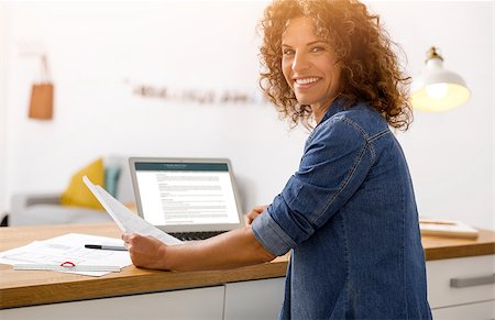 simsearch:400-08613671,k - Middle age woman at the office working with a  laptop Stock Photo - Budget Royalty-Free & Subscription, Code: 400-08863380