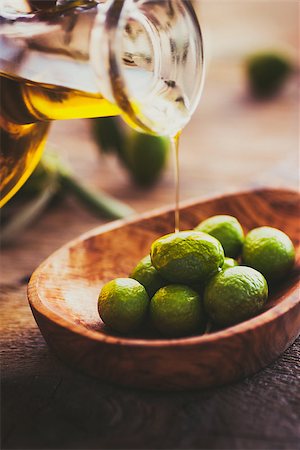 simsearch:400-05666507,k - Extra virgin healthy Olive oil with fresh olives on rustic wooden background Stock Photo - Budget Royalty-Free & Subscription, Code: 400-08863694
