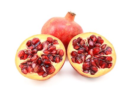 simsearch:640-02656973,k - Whole red pomegranate and two cut halves showing seeds, isolated on a white background Fotografie stock - Microstock e Abbonamento, Codice: 400-08863996