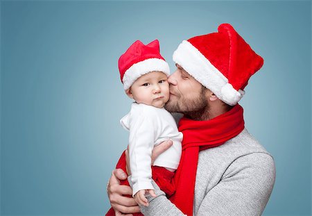 simsearch:400-09222788,k - Father with his baby boy wearing Santa hats celebrating Christmas Photographie de stock - Aubaine LD & Abonnement, Code: 400-08887825