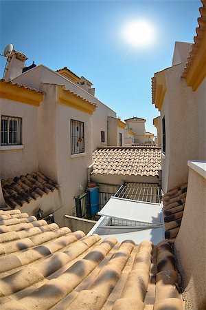 simsearch:400-06357900,k - View among yellow houses on the roof tiles and second floors with towers. Spain Foto de stock - Super Valor sin royalties y Suscripción, Código: 400-08888574