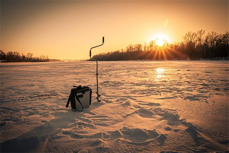 dragunov (artist) - Ice fishing scene with box, drill and a rod on river during sunset Stock Photo - Budget Royalty-Free & Subscription, Code: 400-08888701