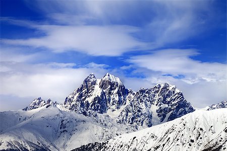 simsearch:400-08671175,k - Snow mountains and blue sky with clouds in winter. Caucasus Mountains. Svaneti region of Georgia. Mounts Ushba and Chatyn. Stock Photo - Budget Royalty-Free & Subscription, Code: 400-08888900