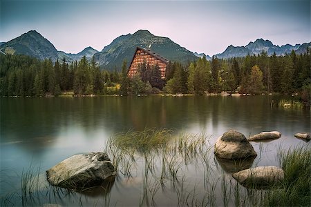 Strbske Pleso Mountain Lake in High Tatras Mountains, Slovakia with Rocks and Grass in Foreground Stock Photo - Budget Royalty-Free & Subscription, Code: 400-08888936