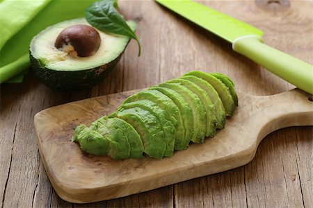simsearch:400-07894253,k - healthy eating - ripe avocado on a wooden board Photographie de stock - Aubaine LD & Abonnement, Code: 400-08889248