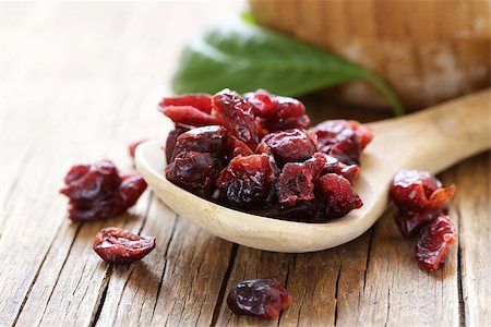 simsearch:400-08334670,k - Dried berries red cranberries on a wooden table Stock Photo - Budget Royalty-Free & Subscription, Code: 400-08889249