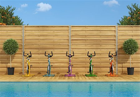 swimming pool exercise bikes - Swimming pool with colorful spinning bike poolside - 3d rendering Photographie de stock - Aubaine LD & Abonnement, Code: 400-08889736