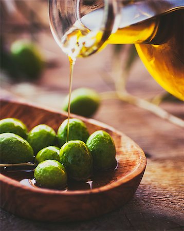 simsearch:400-05666507,k - Extra virgin healthy Olive oil with fresh olives on rustic wooden background Stock Photo - Budget Royalty-Free & Subscription, Code: 400-08898645