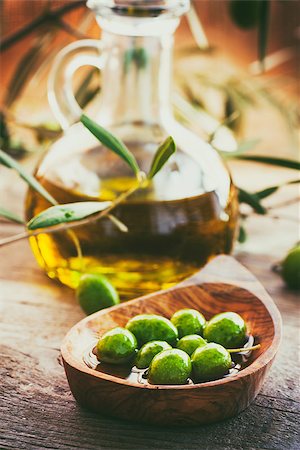 simsearch:400-05666507,k - Extra virgin healthy Olive oil with fresh olives on rustic wooden background Stock Photo - Budget Royalty-Free & Subscription, Code: 400-08898646