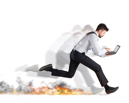 simsearch:400-09028668,k - Businessman runs quickly with laptop leaving fire trails. Fast business concept Stock Photo - Budget Royalty-Free & Subscription, Code: 400-08899015