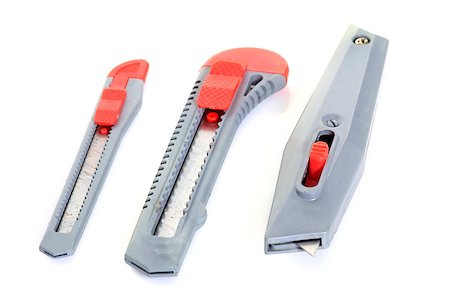 stanley knife - three box cutters in front of white background Stock Photo - Budget Royalty-Free & Subscription, Code: 400-08899313