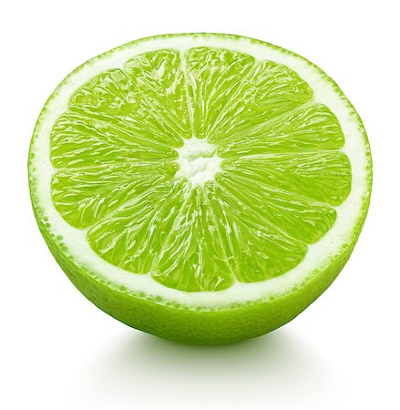 simsearch:400-08900179,k - Ripe half of green lime citrus fruit isolated on white background with clipping path Photographie de stock - Aubaine LD & Abonnement, Code: 400-08899331