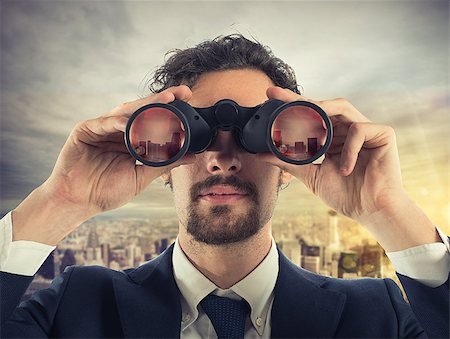 simsearch:400-08812456,k - Businessman looks at the city from the roof with binoculars Stock Photo - Budget Royalty-Free & Subscription, Code: 400-08899406