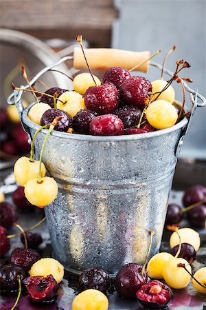 simsearch:400-08672192,k - Fresh wet yellow and red cherry in a bucket Photographie de stock - Aubaine LD & Abonnement, Code: 400-08899740