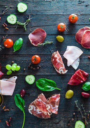 roasted ham - Italian ham, prosciutto and salami. Ingredients for bruschetta, crostini or sandwich bar. Rustic top view of ingredients. Ham with vegetables and spices Stock Photo - Budget Royalty-Free & Subscription, Code: 400-08899958