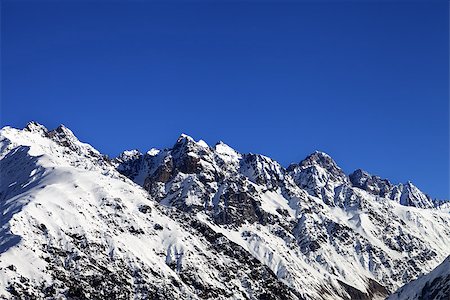 simsearch:400-08671175,k - Snowy rocks and blue clear sky at cold sun day. Caucasus Mountains. Svaneti region of Georgia. Stock Photo - Budget Royalty-Free & Subscription, Code: 400-08890646