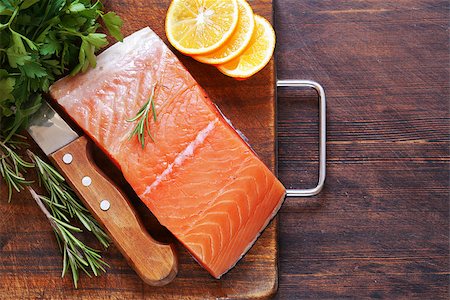 food top of view - fresh red fish fillet of salmon with lemon and herbs Stock Photo - Budget Royalty-Free & Subscription, Code: 400-08890747