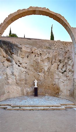 simsearch:400-04544257,k - Panorama of the ruins of the chapel in the castle of Santa Barbara, with preserved arches and figures of saints. Green trees, bridge, leading upstairs, blue sky. Photographie de stock - Aubaine LD & Abonnement, Code: 400-08891214