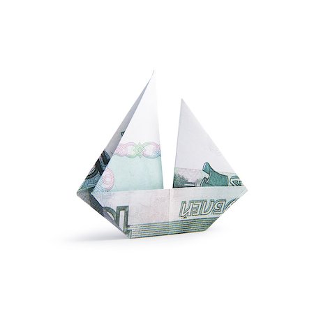 simsearch:400-08997019,k - origami ship from banknotes on a white background Stock Photo - Budget Royalty-Free & Subscription, Code: 400-08891312