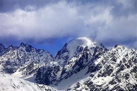 simsearch:400-07093256,k - Snow mountaims in clouds at sunny winter day. Caucasus Mountains. Svaneti region of Georgia. Stock Photo - Budget Royalty-Free & Subscription, Code: 400-08891362