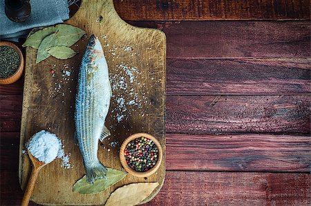 simsearch:400-06088770,k - Fresh fish smelt spices for cooking on a kitchen board, top view Stock Photo - Budget Royalty-Free & Subscription, Code: 400-08891584