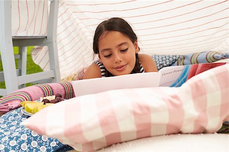 Girl Reading Book and Eating Snack In Home Made Garden Den Stock Photo - Budget Royalty-Free & Subscription, Code: 400-08891707