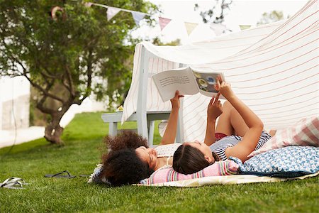 Mother And Daughter Playing In Home Made Garden Den Stock Photo - Budget Royalty-Free & Subscription, Code: 400-08891703