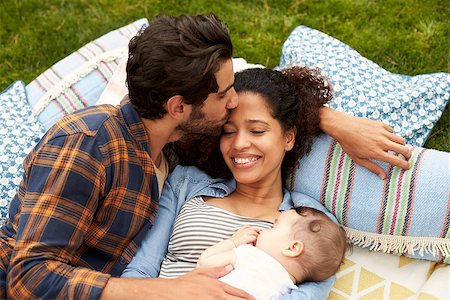 Overhead View Of Family With Baby Relaxing On Rug In Garden Stock Photo - Budget Royalty-Free & Subscription, Code: 400-08891725