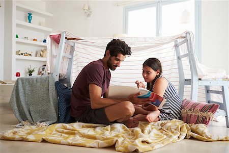 simsearch:400-08891803,k - Father And Daughter Playing Indoors In Home Made Den Stock Photo - Budget Royalty-Free & Subscription, Code: 400-08891802