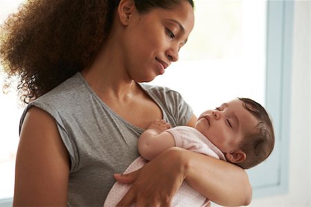 simsearch:400-08891803,k - Close Up Of Mother Cuddling Sleeping Baby Daughter At Home Stock Photo - Budget Royalty-Free & Subscription, Code: 400-08891810