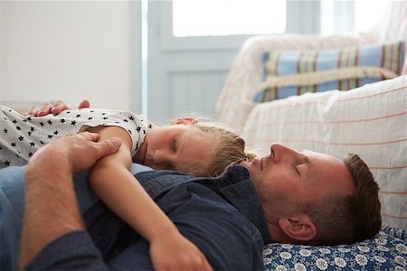 Father And Daughter Lying On Floor Asleep Together Stock Photo - Budget Royalty-Free & Subscription, Code: 400-08891874