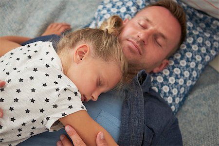 Father And Daughter Lying On Floor Asleep Together Stock Photo - Budget Royalty-Free & Subscription, Code: 400-08891875