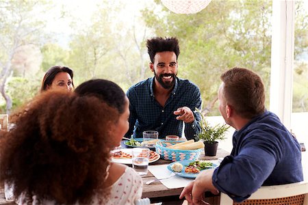 Friends Enjoying Outdoor Meal On Terrace Together Stock Photo - Budget Royalty-Free & Subscription, Code: 400-08891879