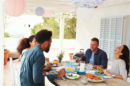 simsearch:400-08292251,k - Friends Enjoying Outdoor Meal On Terrace Together Stock Photo - Budget Royalty-Free & Subscription, Code: 400-08891885