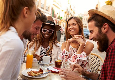 Friends on vacation having fun outside a cafe in Ibiza, close up Photographie de stock - Aubaine LD & Abonnement, Code: 400-08892058