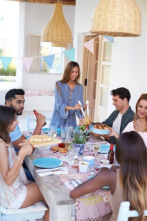 simsearch:400-08892368,k - Hostess serving friends at a dinner party on a patio, Ibiza Stock Photo - Budget Royalty-Free & Subscription, Code: 400-08892174