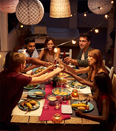 Friends making a toast at a patio dinner party, vertical Stock Photo - Budget Royalty-Free & Subscription, Code: 400-08892197