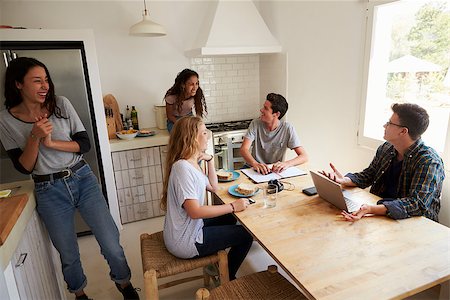 simsearch:400-08892339,k - Teens hanging out in kitchen, doing homework and making food Stock Photo - Budget Royalty-Free & Subscription, Code: 400-08892358