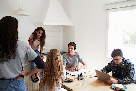 simsearch:400-08892339,k - Teens hanging out in kitchen, doing homework and talking Stock Photo - Budget Royalty-Free & Subscription, Code: 400-08892376