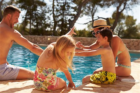 Family On Vacation Having Fun By Outdoor Pool Stock Photo - Budget Royalty-Free & Subscription, Code: 400-08892456