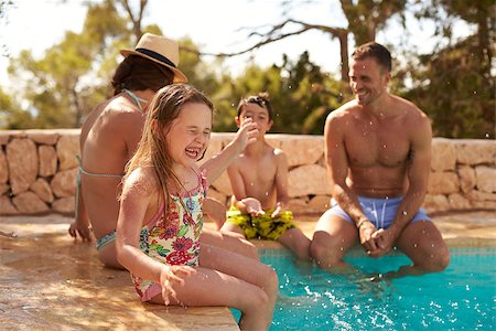 Family On Vacation Having Fun By Outdoor Pool Stock Photo - Budget Royalty-Free & Subscription, Code: 400-08892462