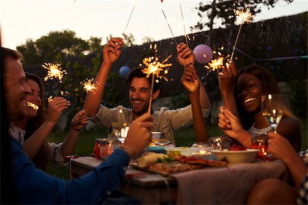 Friends With Sparklers Eating Food And Enjoying Party Stock Photo - Budget Royalty-Free & Subscription, Code: 400-08892517