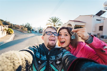 real estate: couple showing keys of their new house Stock Photo - Budget Royalty-Free & Subscription, Code: 400-08892655