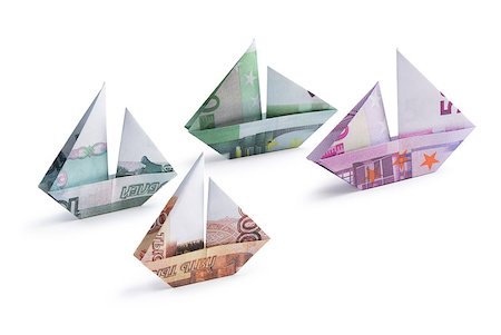 simsearch:400-08997019,k - origami ship from banknotes on a white background Stock Photo - Budget Royalty-Free & Subscription, Code: 400-08892716