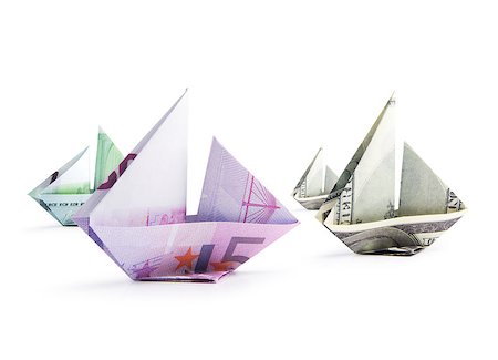 simsearch:400-08997019,k - origami ship from banknotes on a white background Stock Photo - Budget Royalty-Free & Subscription, Code: 400-08892717