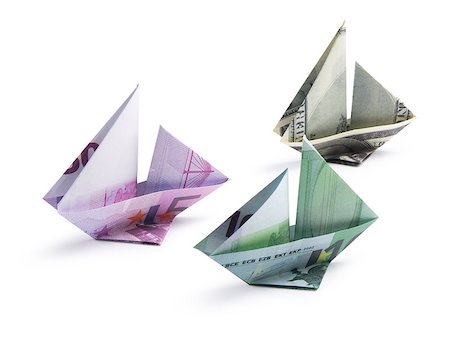 simsearch:400-08997019,k - origami ship from banknotes on a white background Stock Photo - Budget Royalty-Free & Subscription, Code: 400-08892718