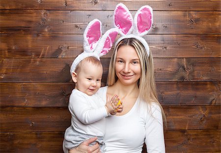 simsearch:400-08787277,k - Easter concept. Happy mother and her cute child wearing bunny ears getting ready for Easter Stock Photo - Budget Royalty-Free & Subscription, Code: 400-08892747