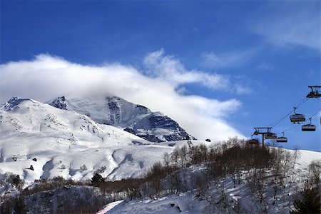simsearch:400-08780271,k - Ski-lift, off-piste slope and mountain in clouds. Caucasus Mountains. Mount Tetnuldi, Svaneti region of Georgia. Photographie de stock - Aubaine LD & Abonnement, Code: 400-08892763